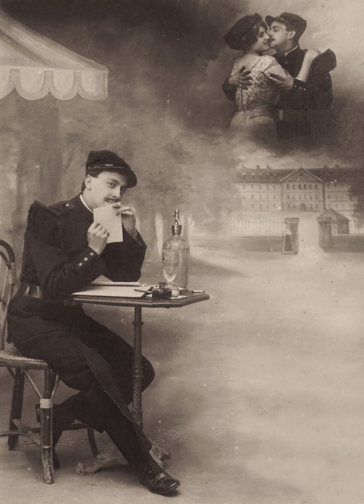 A vintage sepia-toned photo of a soldier writing a letter with a romantic overlay of a couple hugging.