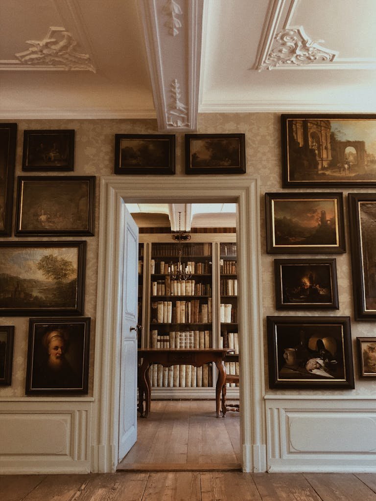 A library room featuring classic art and books with elegant wood detailing in Frankfurt.