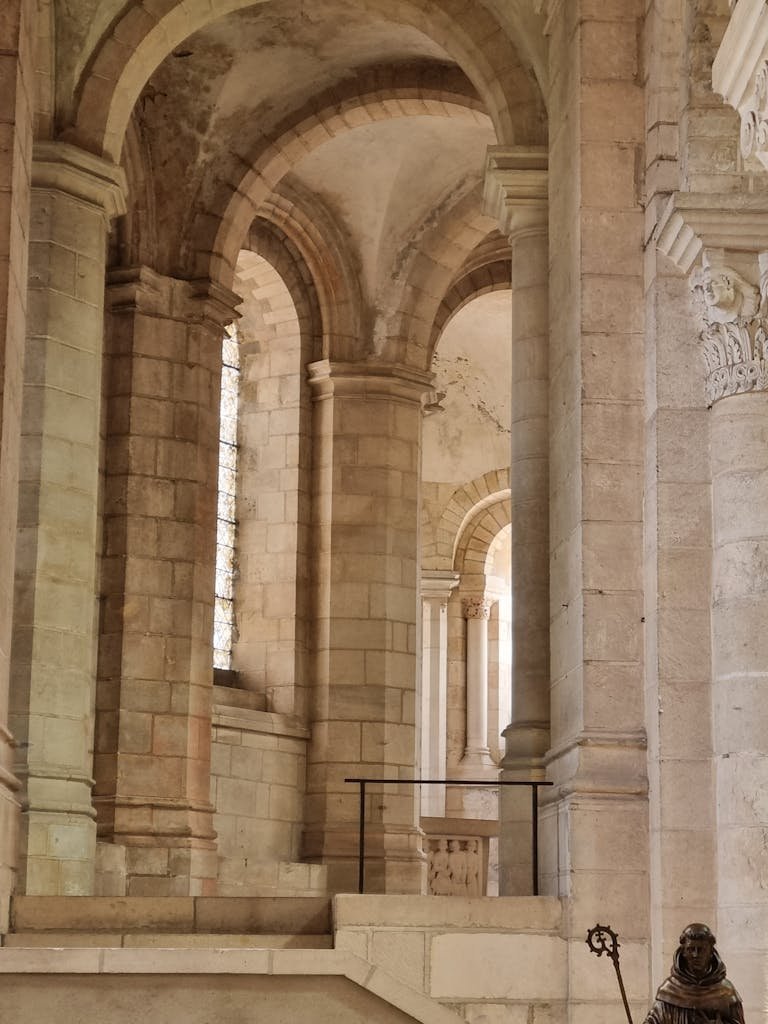 Romanesque architecture in a French abbey corridor, capturing the historic charm and structural elegance.
